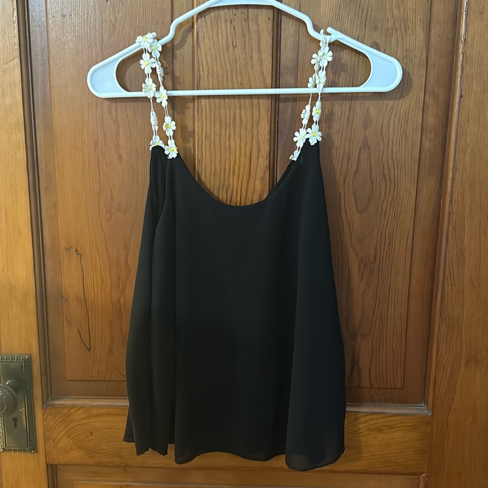 Black silk flowing tank top with white and yellow daisy straps